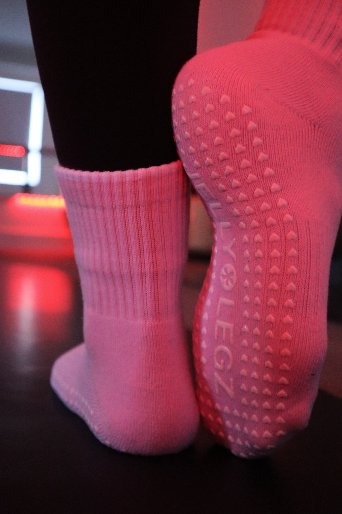 Pink socks with extra grippy grips for barre and infrared pilates