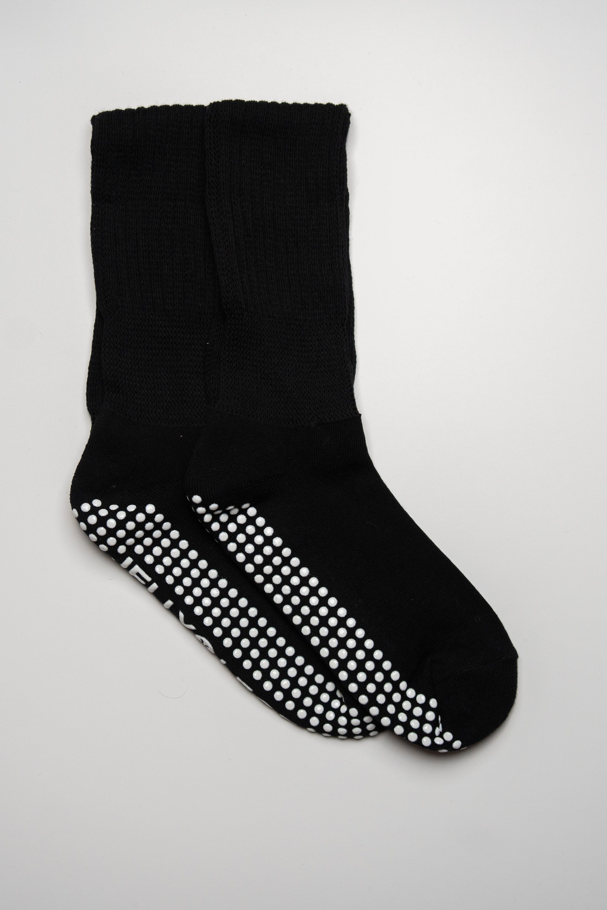 black slouch luxury grip pilates socks with white rim