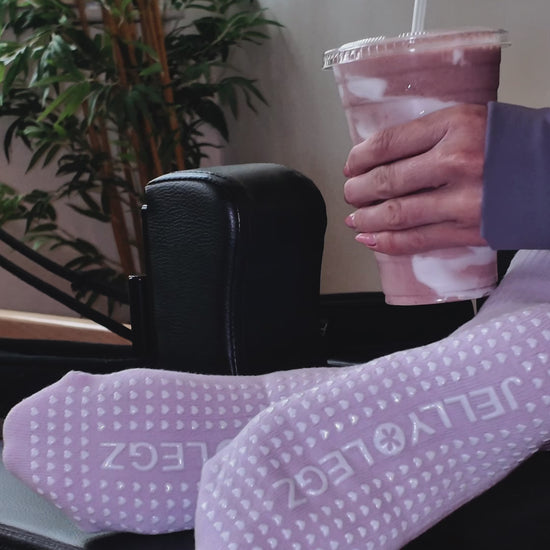 pink crew luxury pilates grip socks by jellylegz girl holding matcha