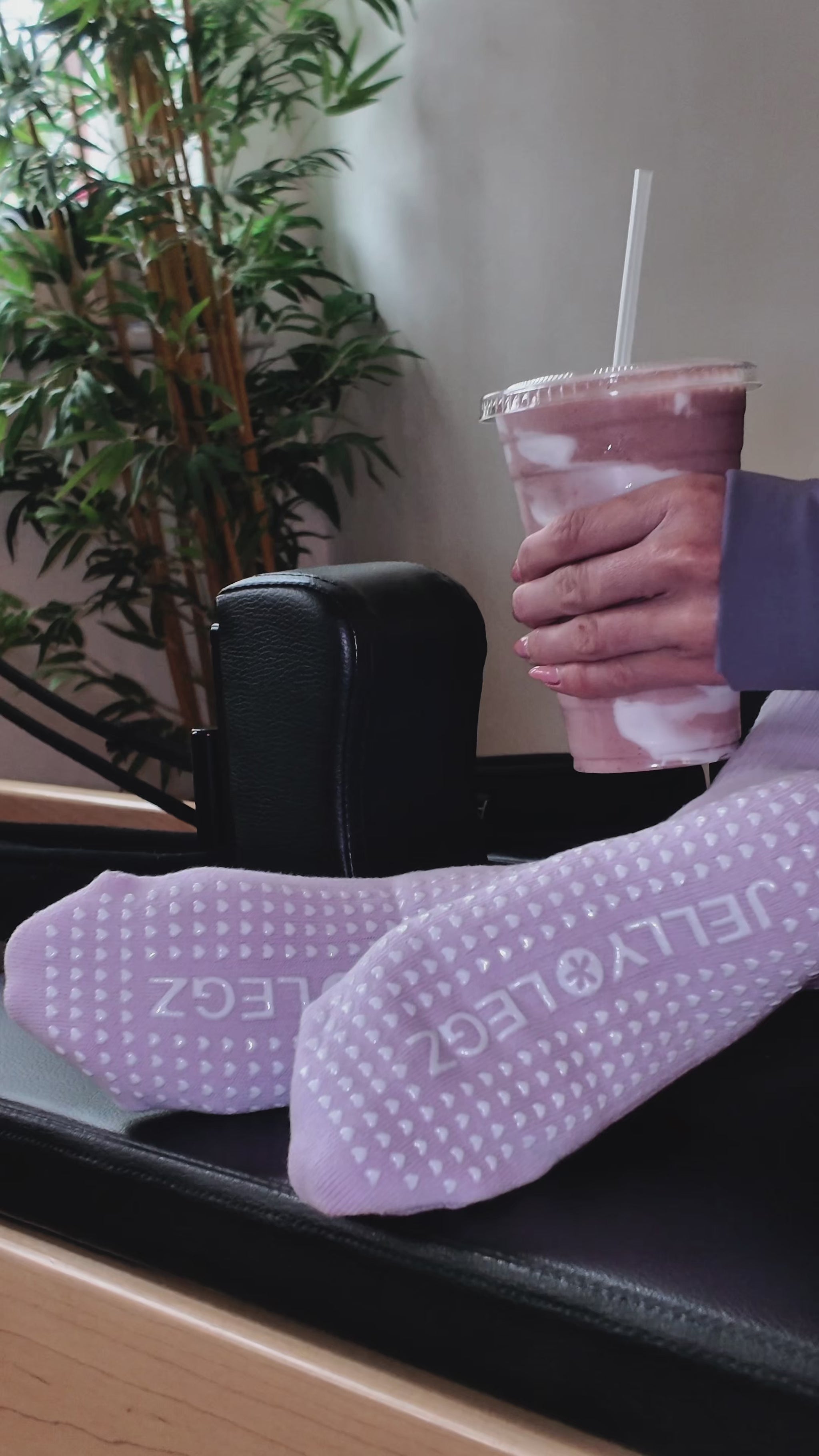 pink crew luxury pilates grip socks by jellylegz girl holding matcha