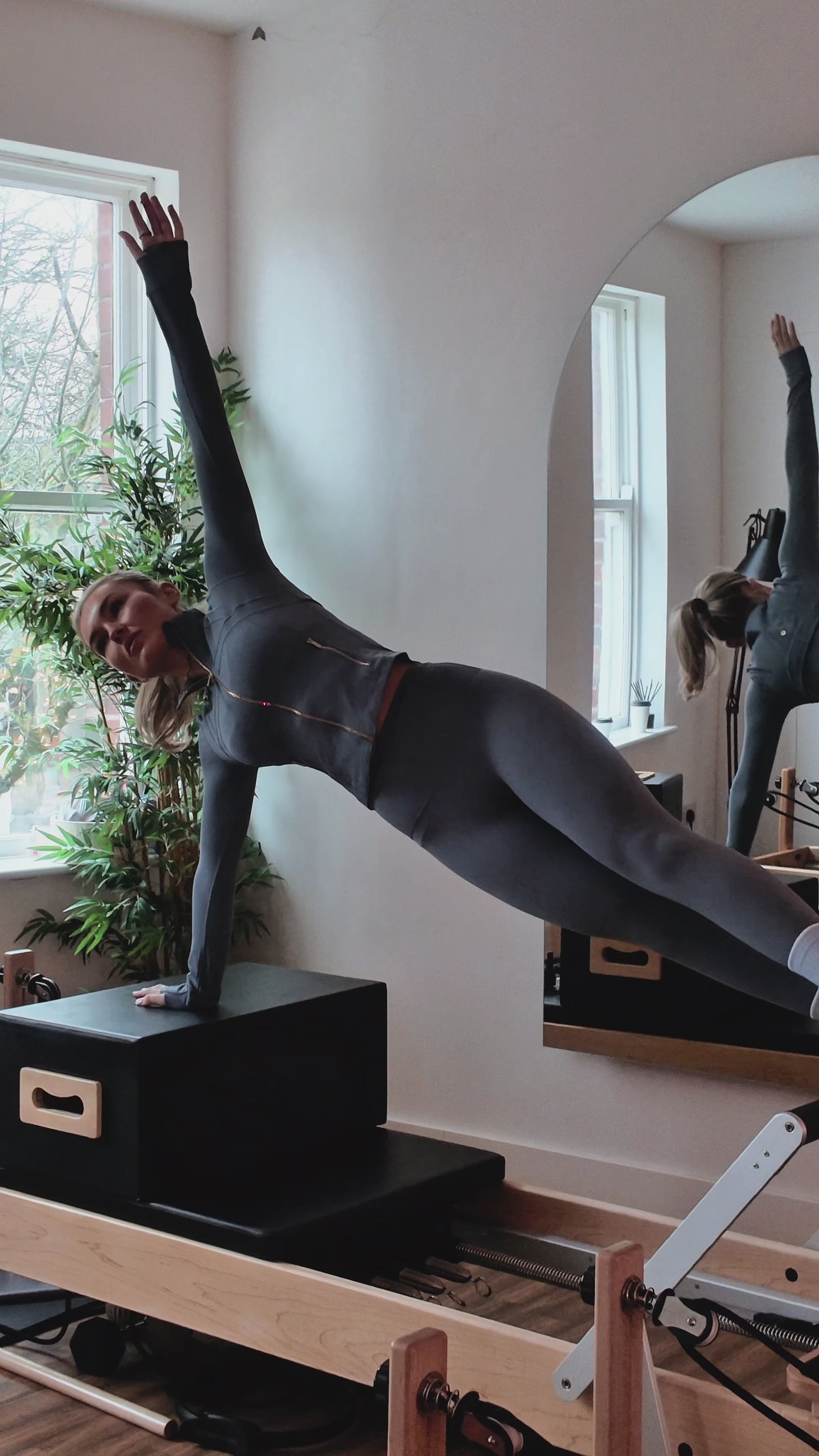Load video: pale blue with white tip luxury grip pilates socks on girl doing pilates